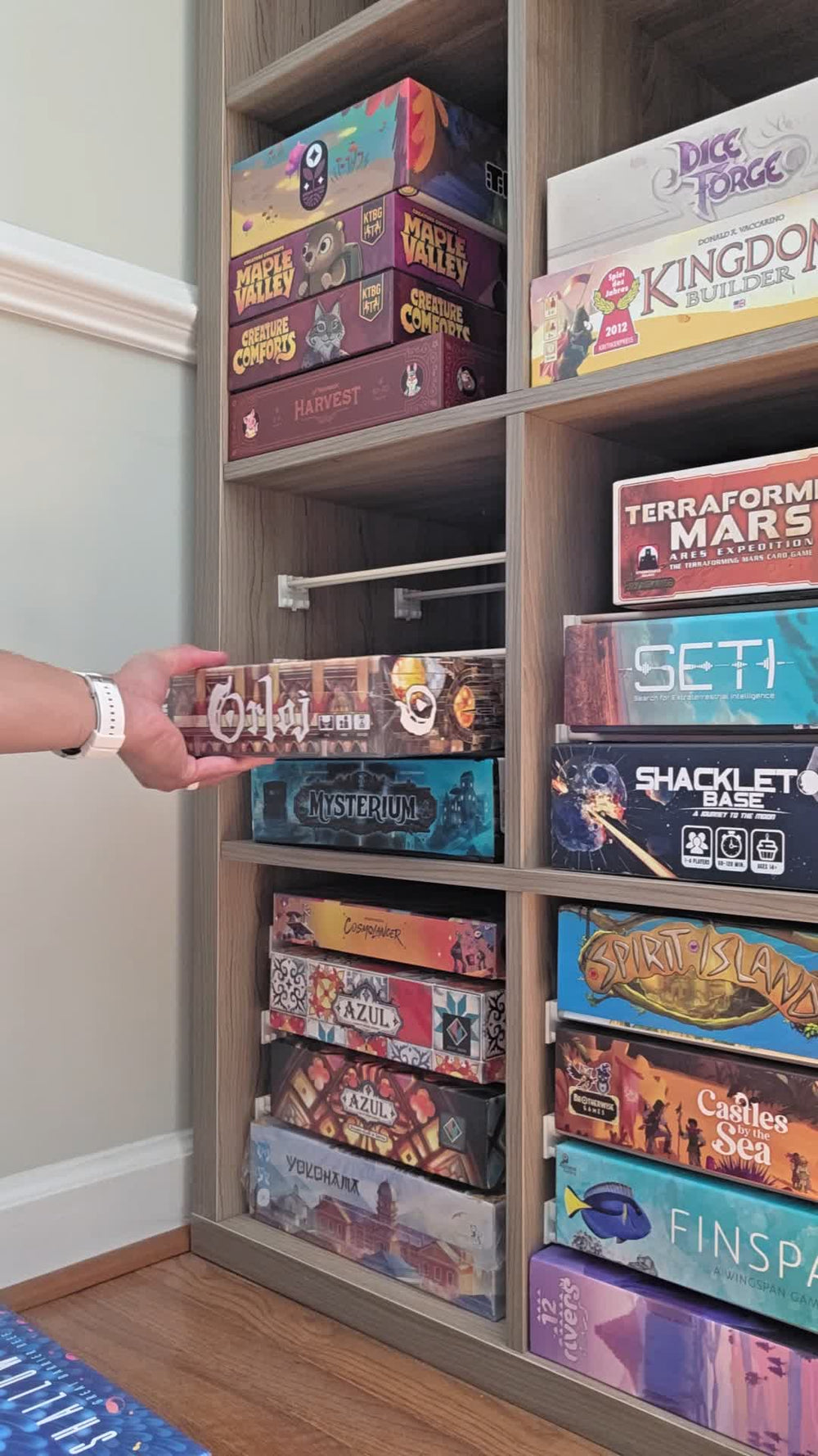 Space-saving board game storage rack for organizing tabletop games and accessories
