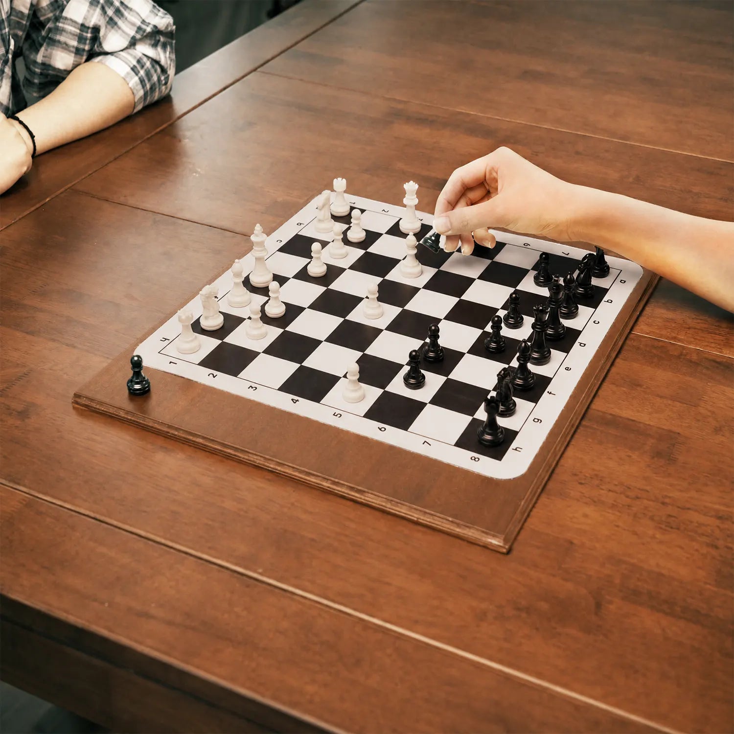 Wooden chess board storage box in use during tabletop play