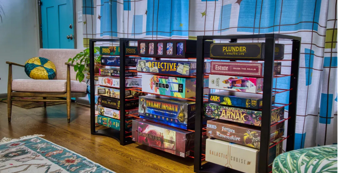 black board game storage shelves filled with board game boxes
