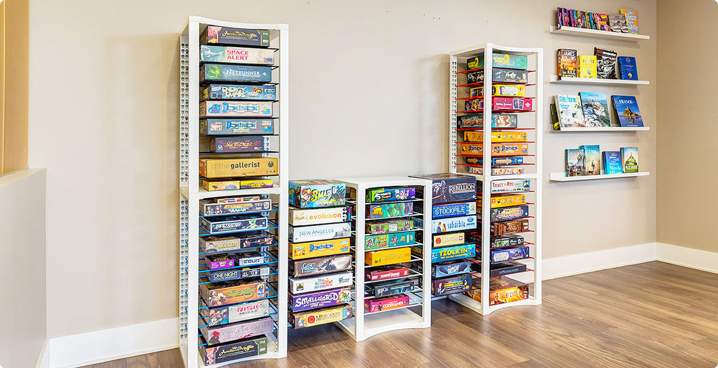White modular game board storage shelves filled with board games