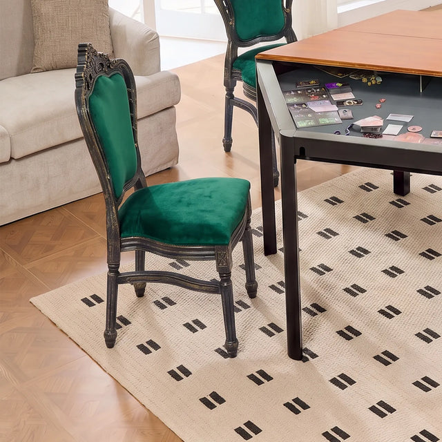 Green upholstered gaming chair with wooden legs in a modern game room