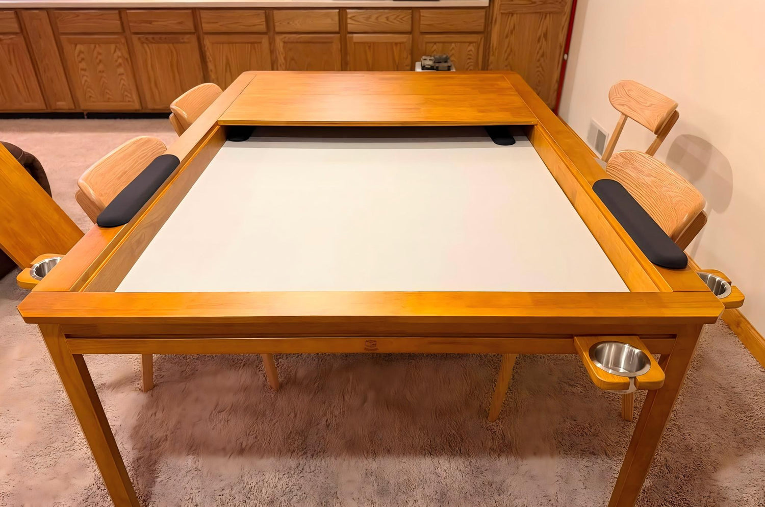 Wooden board game table with recessed play area and built-in cup holders