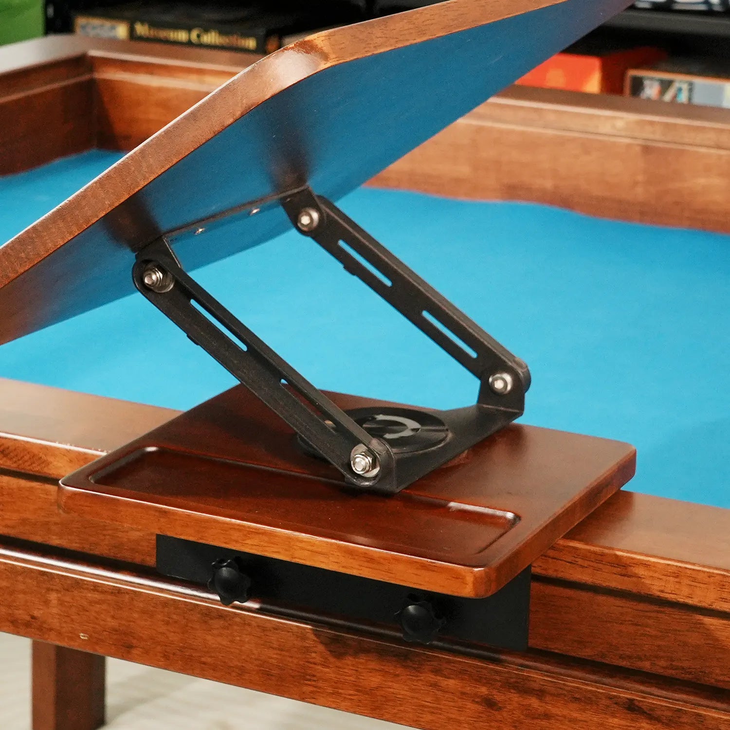 Clamp-on adjustable side desk mounted to a board game table