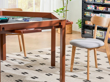 A gaming table with a built-in game board on top