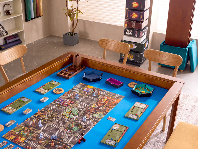 A wooden-framed board game table with a bright blue playing surface