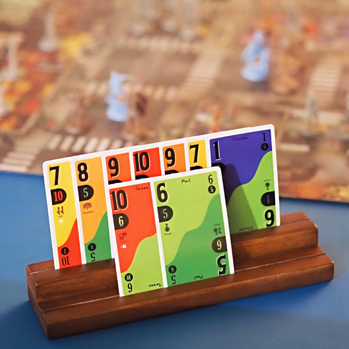 Close-up of painted miniatures and collectibles on a pedestal