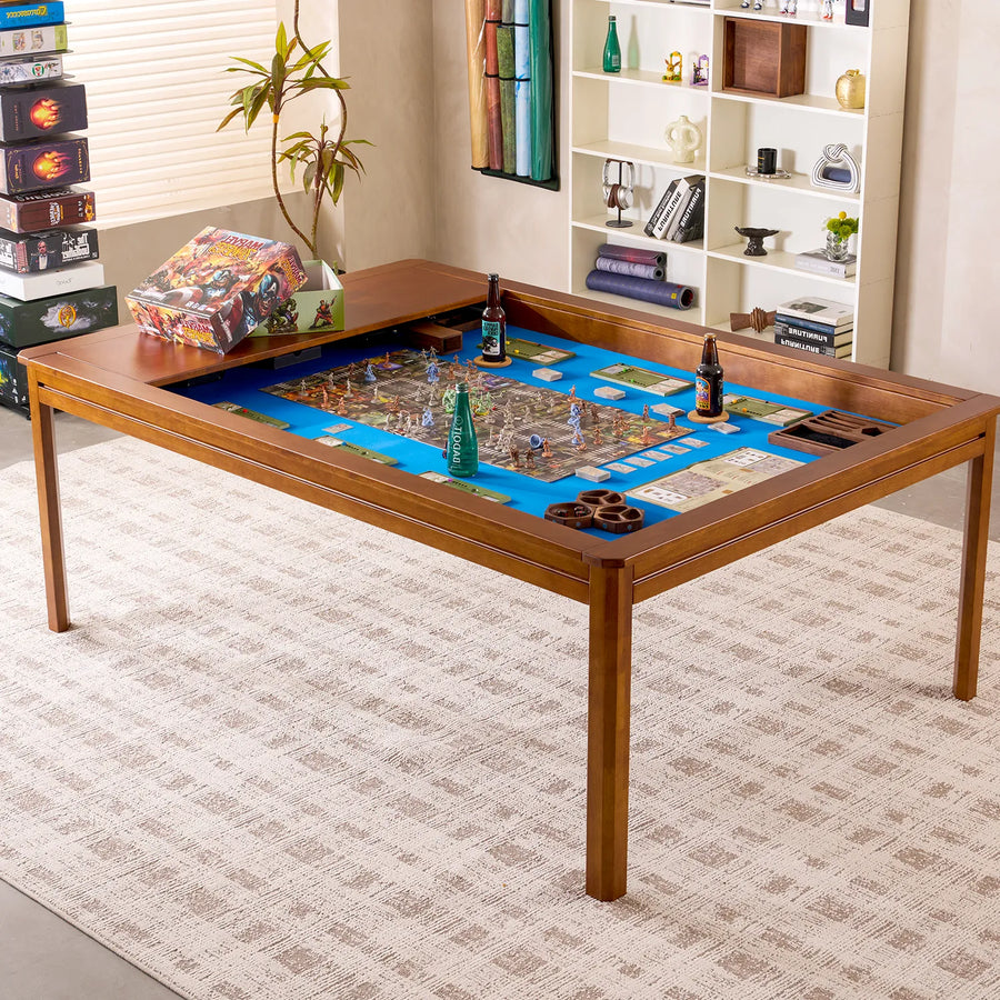Brown rubberwood Kingswood game table with a blue playing surface, board game, and drinks.